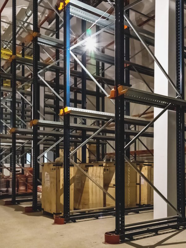 Warehouse interior with empty shelves on factory or plant